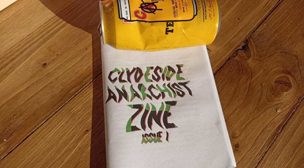 a copy of the zine beside a tennents can with a clydeside anarchist noise sticker on it